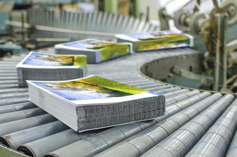 Stacks of mail on a conveyer belt