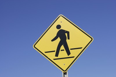 yellow pedestrian crossing sign - canvasser safety