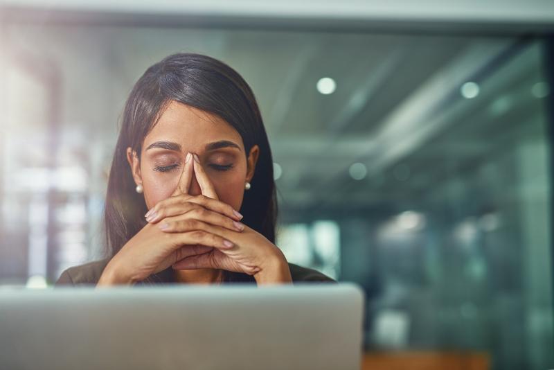 political-consultant Woman upset with head in hands