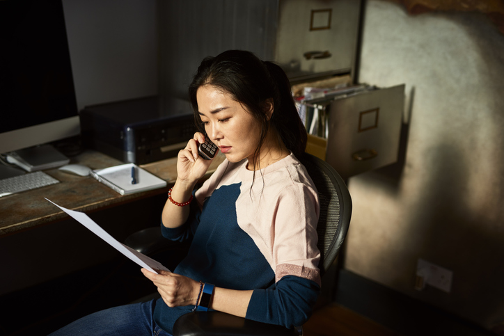 Political direct mail - woman looking at document 