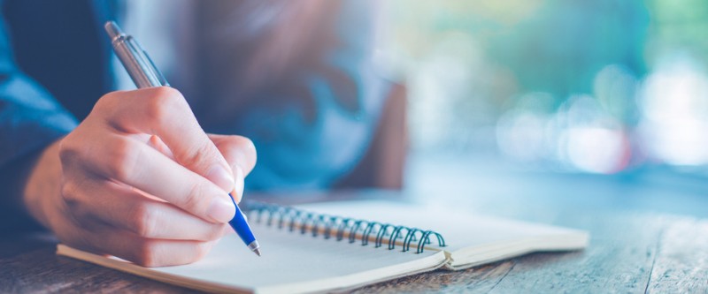 advocacy-training Person writing in notebook