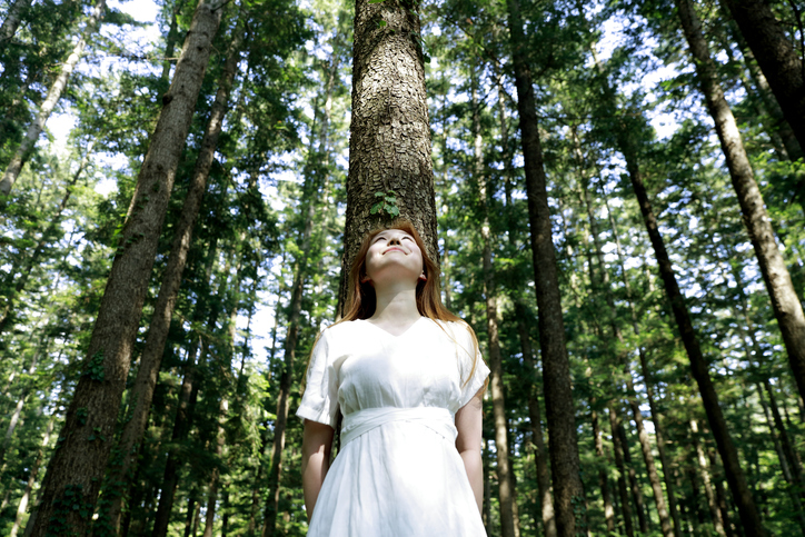 Woman standing in forest