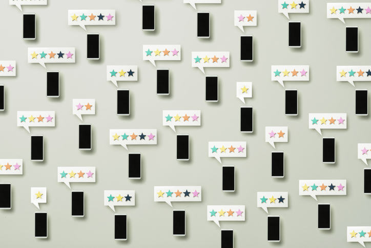 social media activism smart phones scattered with Chat Bubble on each one with star rating