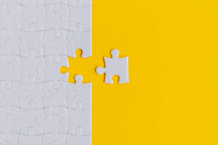 Jigsaw Puzzle on Yellow Background Representing Membership Communications