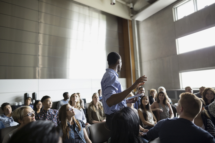 campaign_training Campaign Training -Man speaking among audience