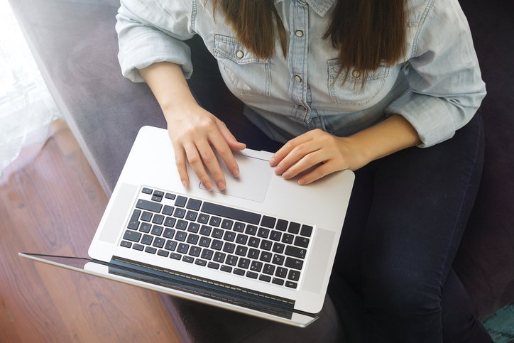 Person typing on laptop