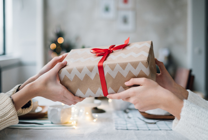 Family Politics -  Picture of people holding a present