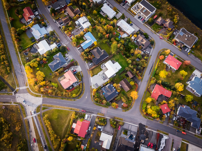 Digital GOTV plan A suburban community of colorful houses.
