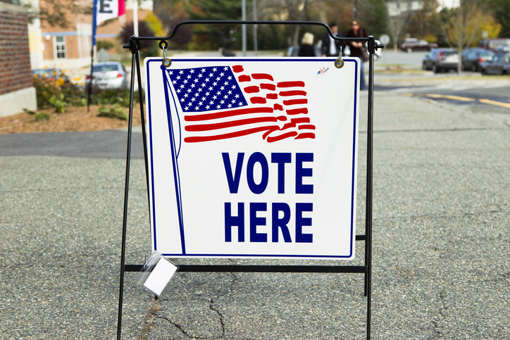 "Vote here" sign hanging outside