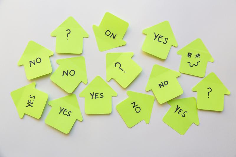 Neon green sticky notes with words, "yes" and "no" on them to symbolize the importance of prioritizing when running a political campaign