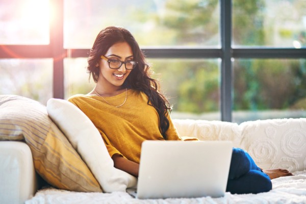 Woman reading laptop political blogs