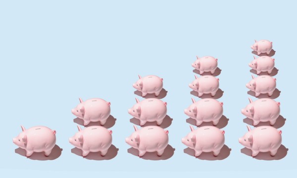 Multiple piggy banks align to form chart