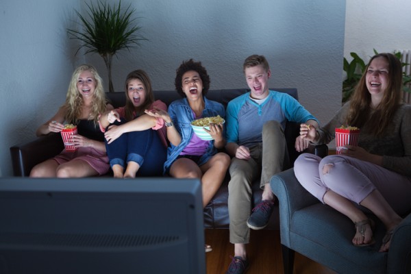 Group of people watch TV