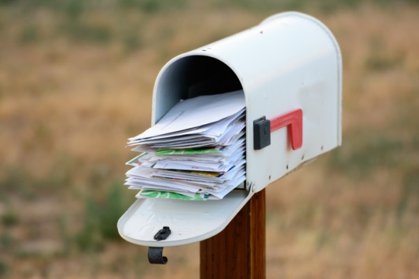 Advocacy mail, white mail box with a lot of letters in it