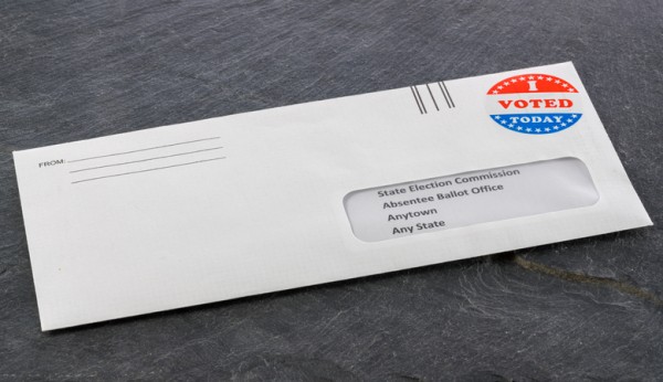 Absentee voting ballot in envelope